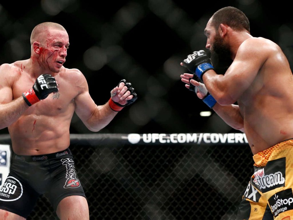 Bloodied Georges St-Pierre UFC 167 octagon intense MMA fight high-contrast sports photo wallpaper