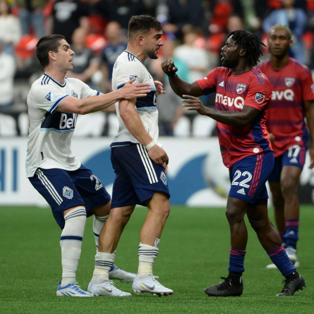 MLS moment Vancouver Whitecaps FC versus FC Dallas players intense action stadium background Wallpaper