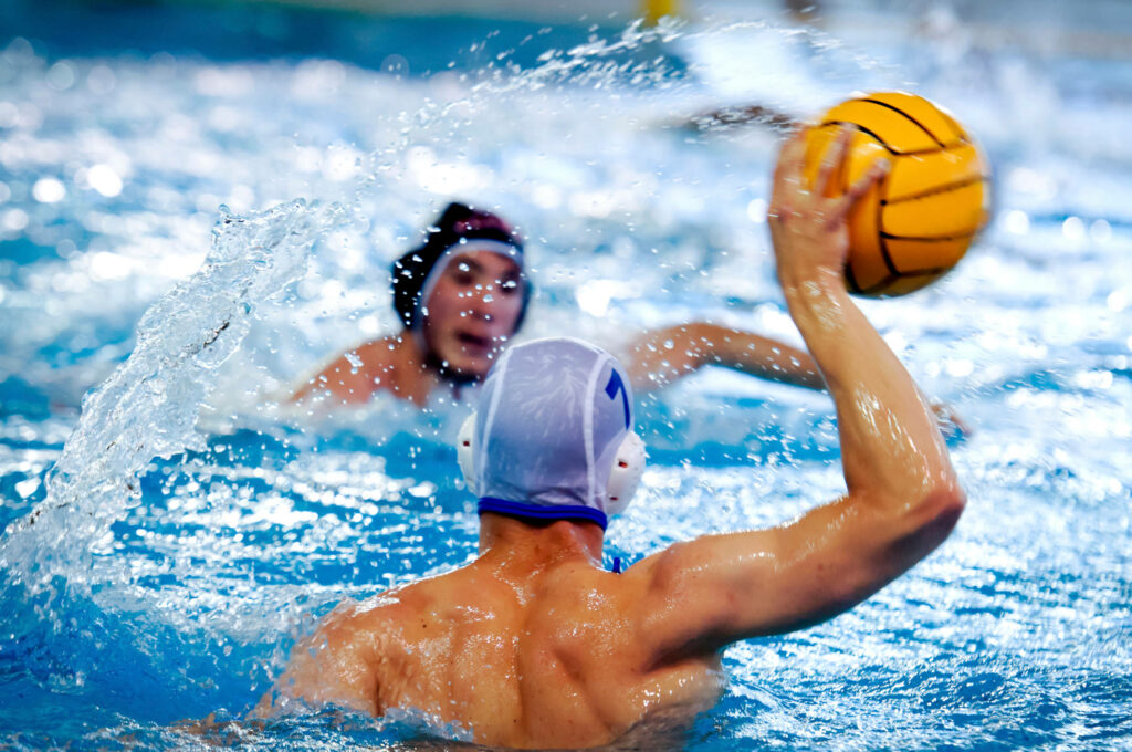 Intense Water Polo Action Wallpaper: Dynamic Throw & Defense