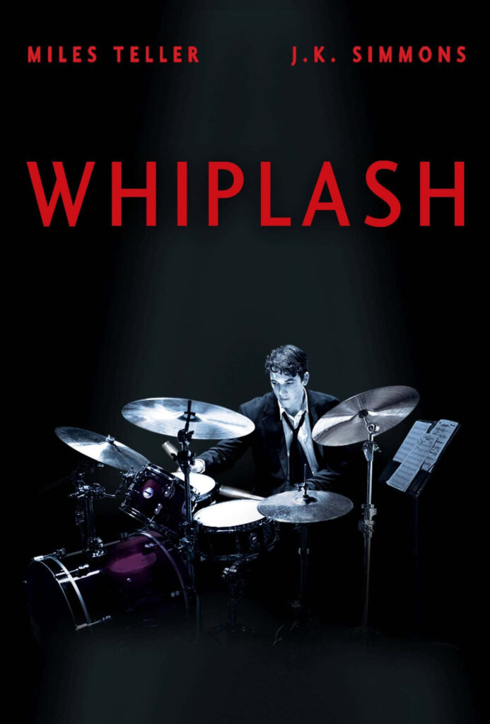 Intense Whiplash Movie Wallpaper: Focused Drummer in Dramatic Lighting