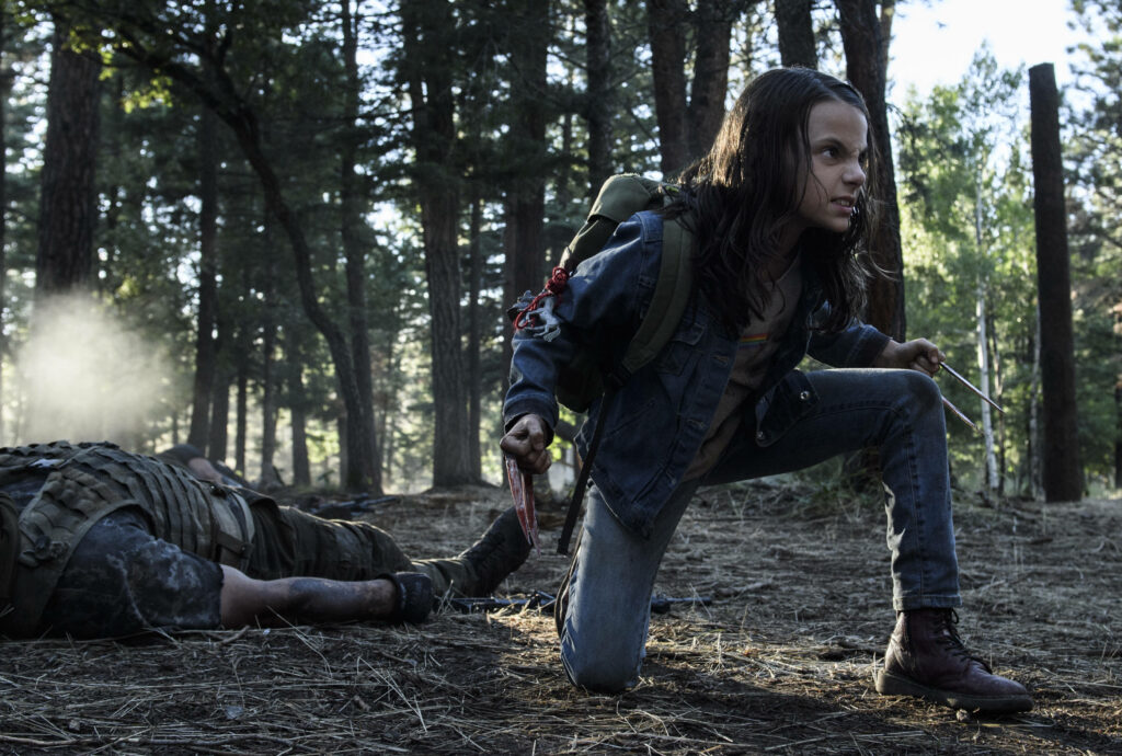 X-23 Wallpaper: Laura Kinney in Intense Forest Background