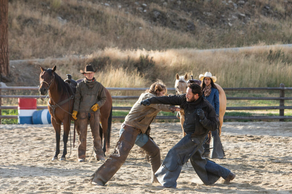 Intense Yellowstone Ranch Fight Scene Wallpaper Background