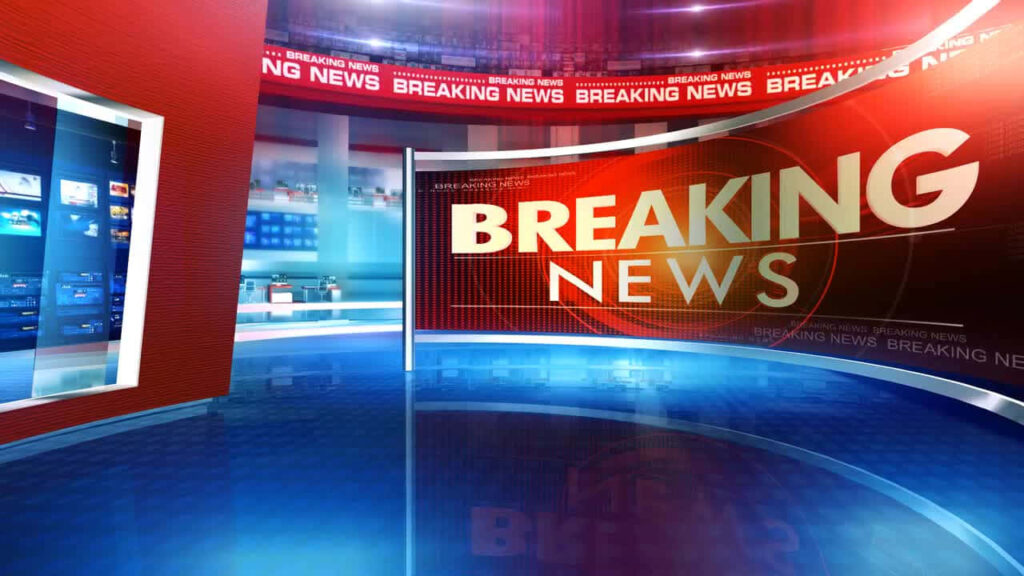 Virtual news studio with breaking news screen vibrant red blue lights and reflective floor Wallpaper