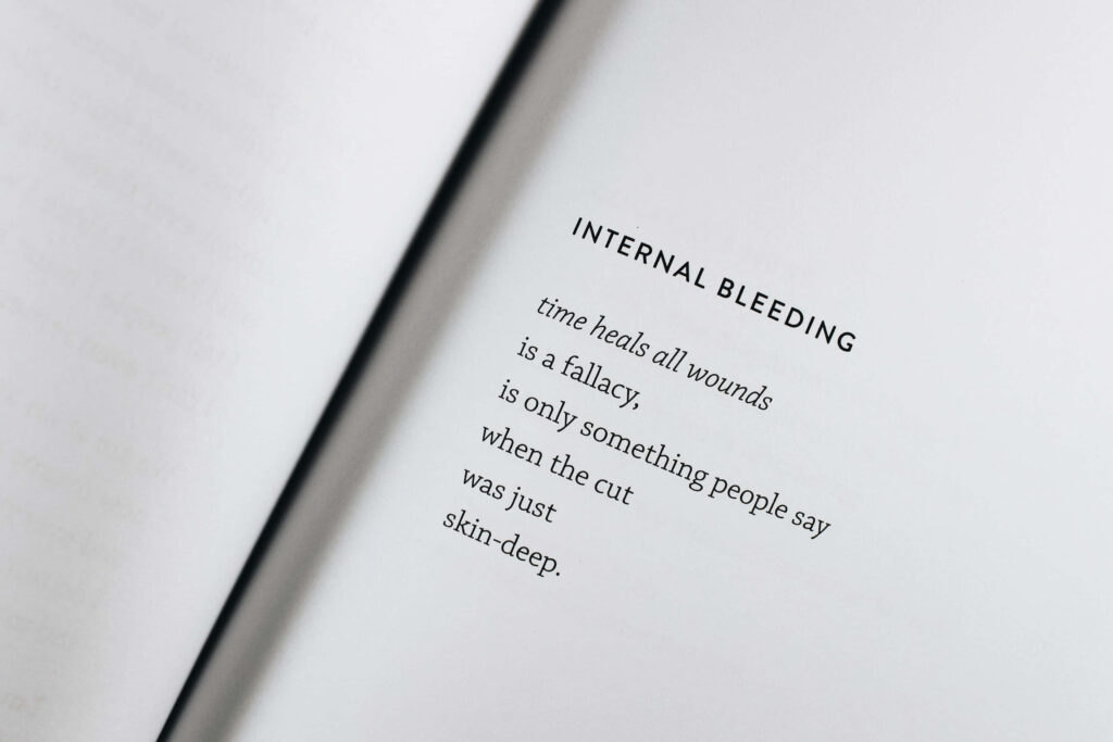 Pages of Pain: Internal Bleeding Quote on Paper Background Wallpaper