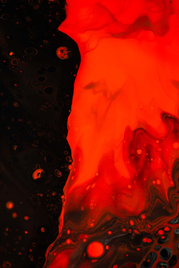 Wall Art Engulfing Red Rivulets on a Profound Black Canvas Wallpaper