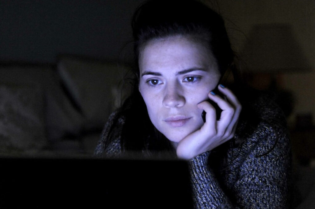 Thought-Provoking Black Mirror Wallpaper: Girl Watching Laptop Scene