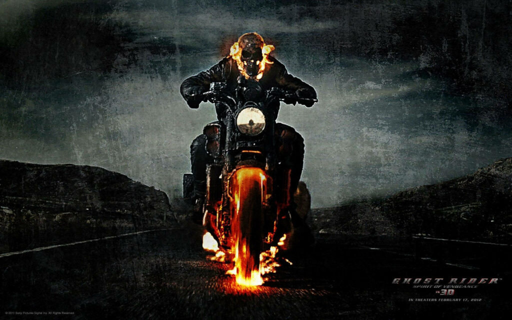 Burning Through the Darkness: Join Ghost Rider on a Fiery Ride Along Wallpaper