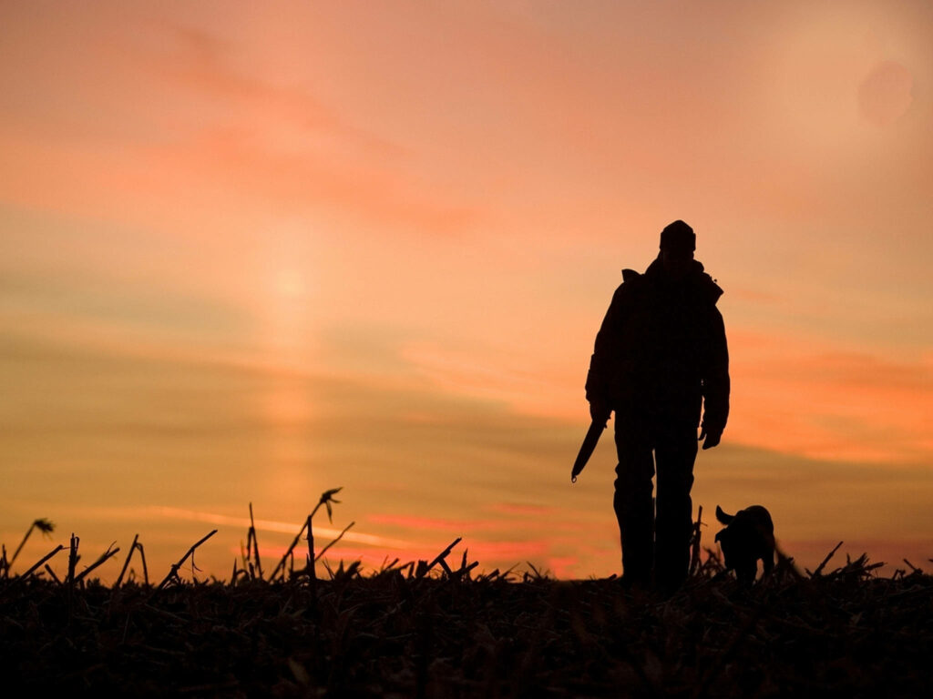 The Master Hunter: Stealthy and Prepared in the Wilderness Wallpaper