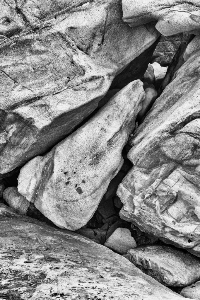 Intricate Natural Stone Relief Black and White Wallpaper Background