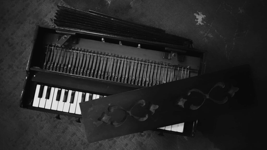 Intricate Black and White Piano Keyboard Wallpaper Background