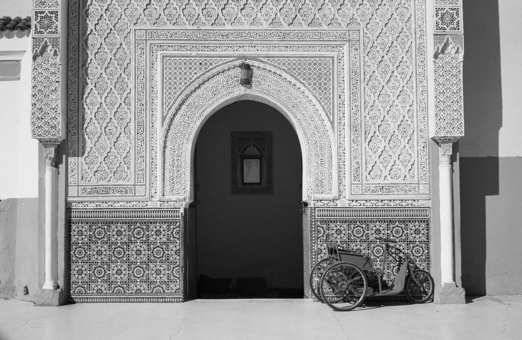 Intricate Black and White Building Wallpaper with Bicycle and Geometric Patterns