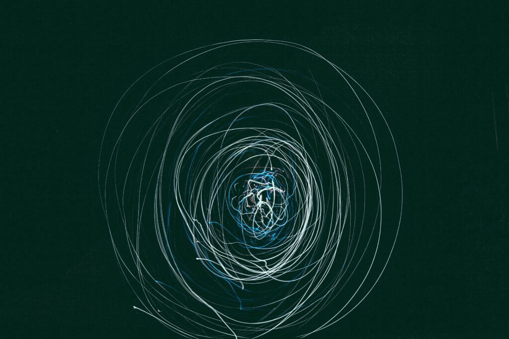 Intricate Blue & White Abstract Wallpaper on Dark Green Background
