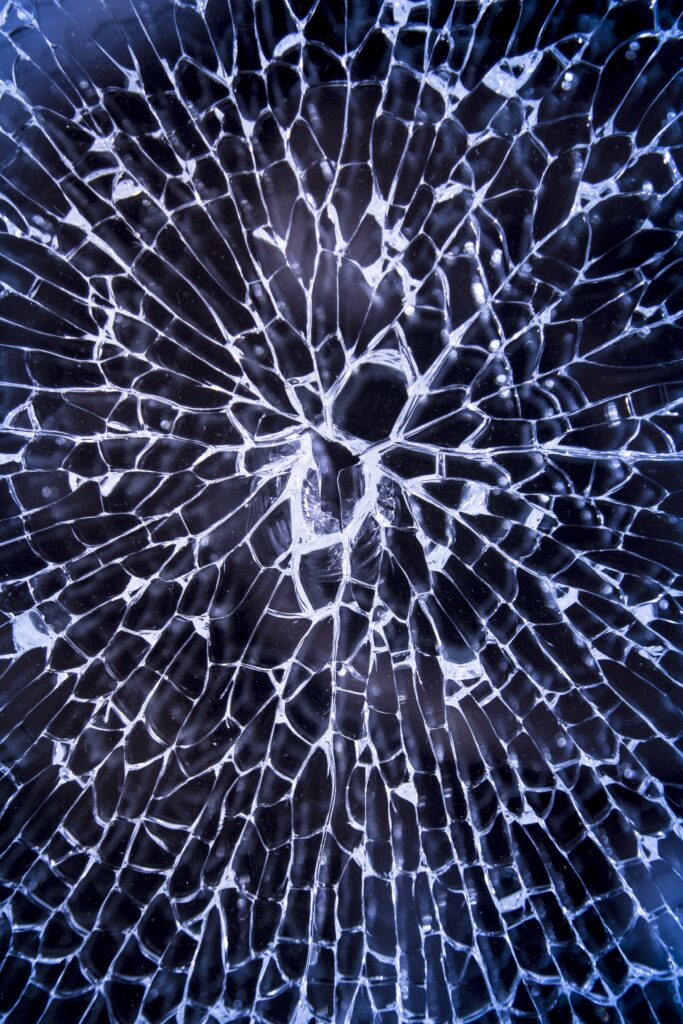 Intricate Broken Glass Wallpaper: Dynamic Shard Patterns Background