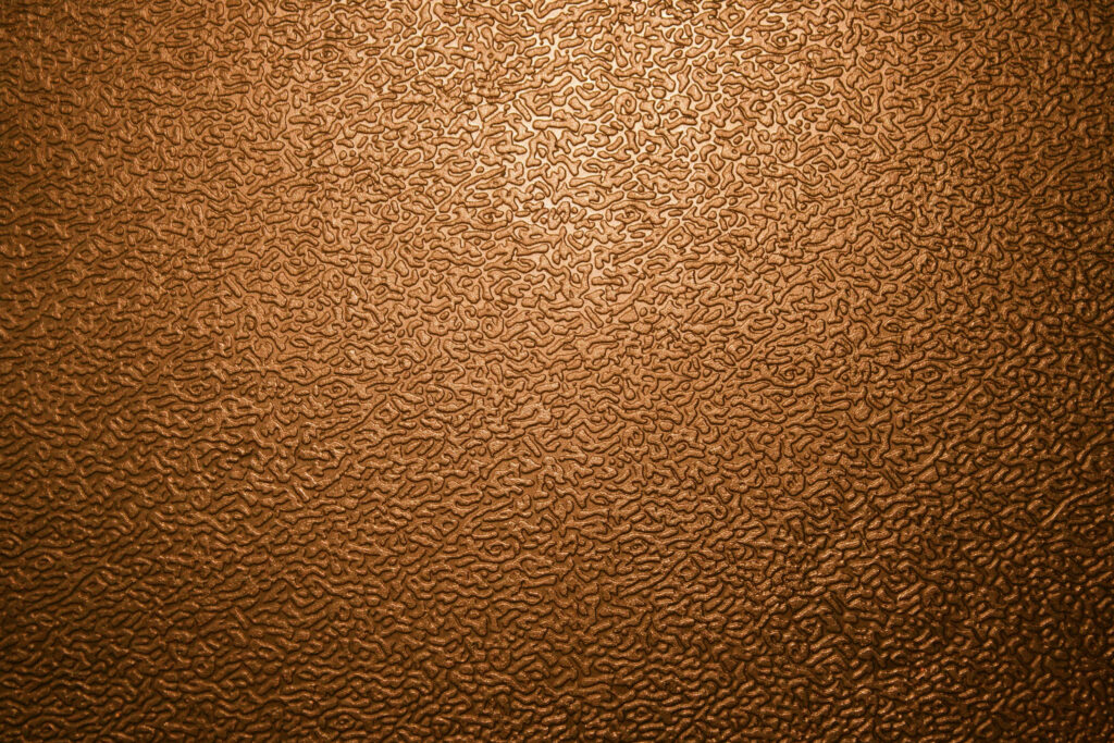 Intricate Brown Leather Textured Wallpaper Background for Sophisticated Spaces