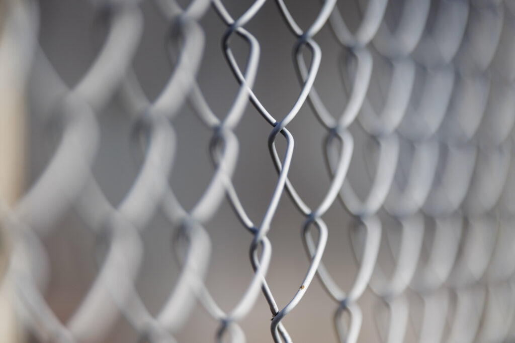 Intricate Wire Mesh Fence Wallpaper: Stunning Macro Texture Background