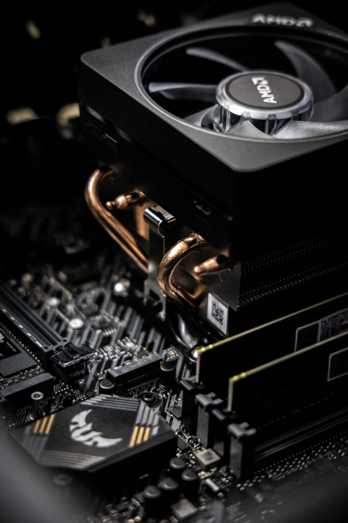 Detailed Computer Components Close-Up: Cooling Fan & Motherboard Wallpaper