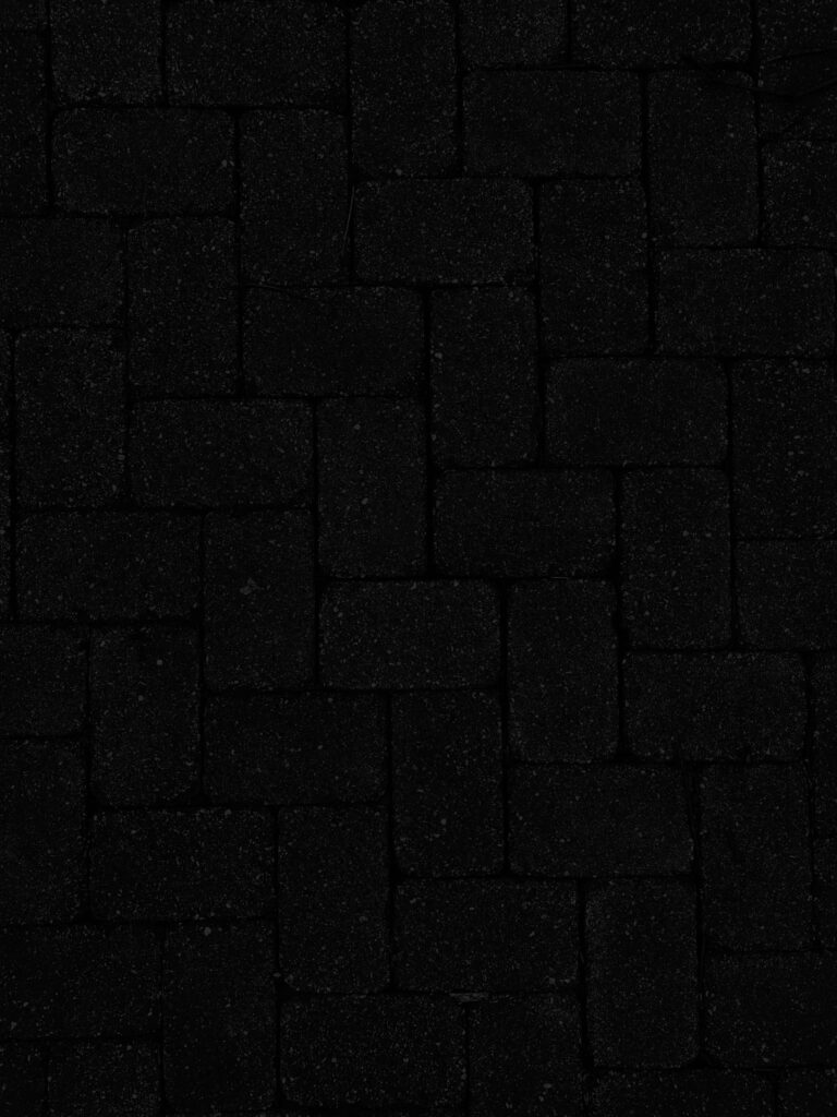 Intricate Dark Brick Wallpaper: Bold Textured Background Design