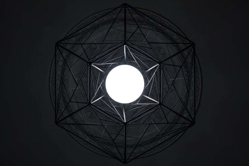 Intricate Dark Geometric Wallpaper with Glowing Central Circle