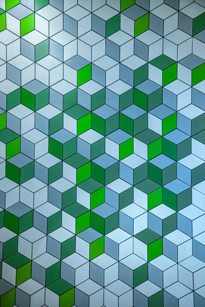 Intricate Geometric Wallpaper: Interlocking Cubes in Green & Blue