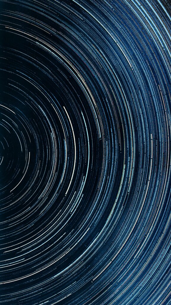 Glowing Circle Wallpaper: Mesmerizing Star Trails Background