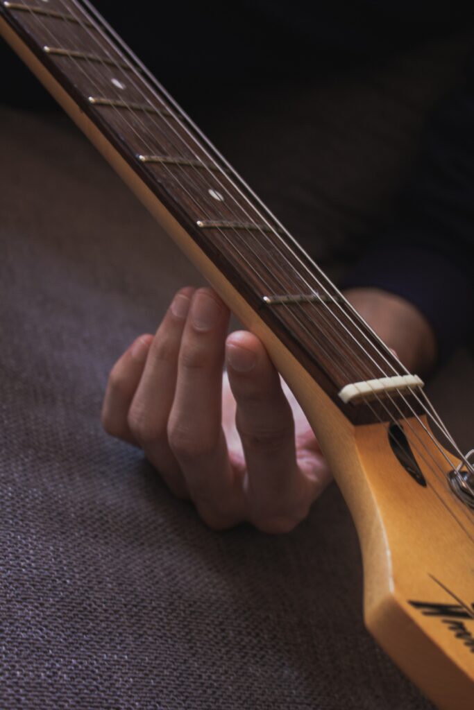 Intricate Guitar Fretboard Close-Up Wallpaper: Music Connection