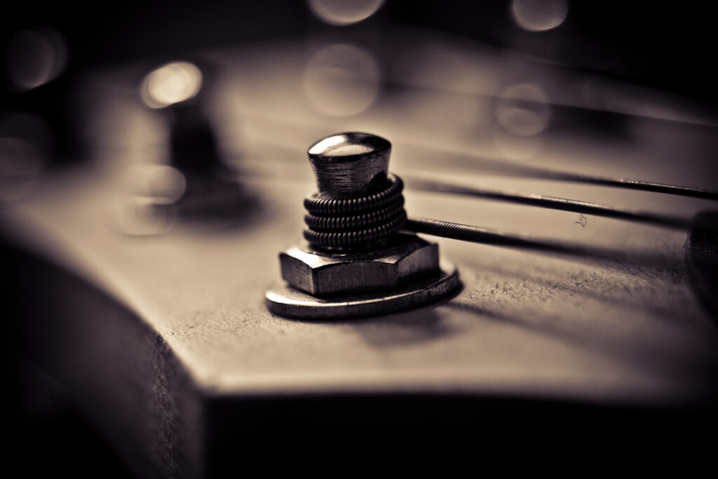 Close-Up Macro of Guitar String & Tuning Peg - Detailed Wallpaper