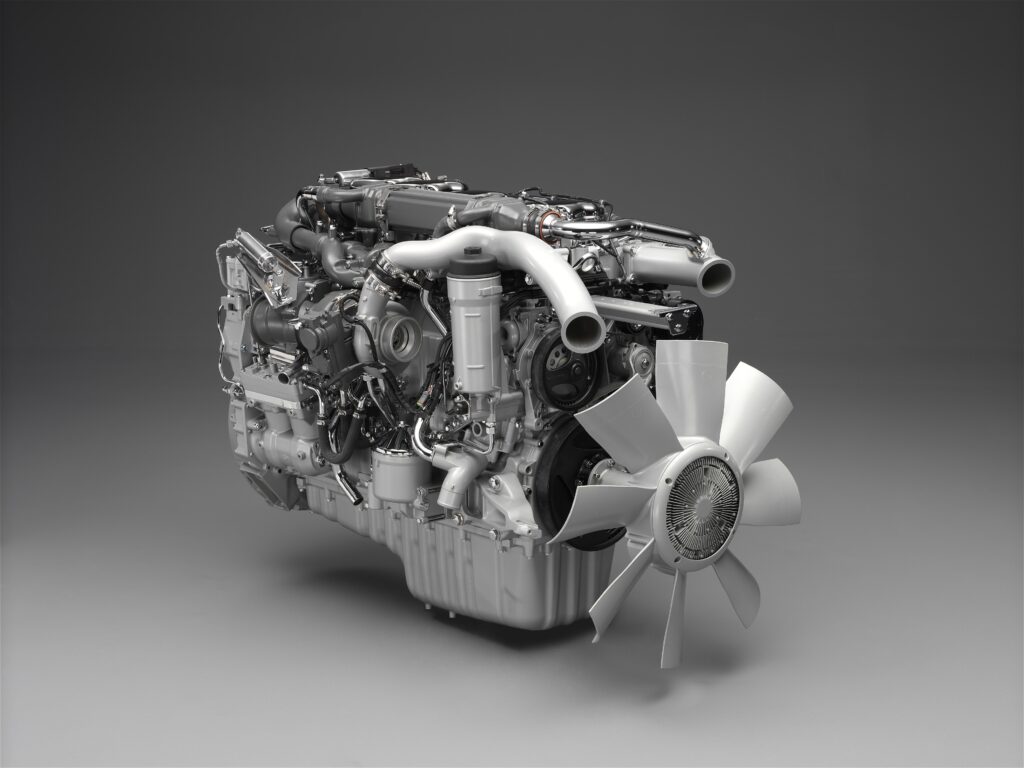 Intricate Industrial Engine Wallpaper on Smooth Gray Background