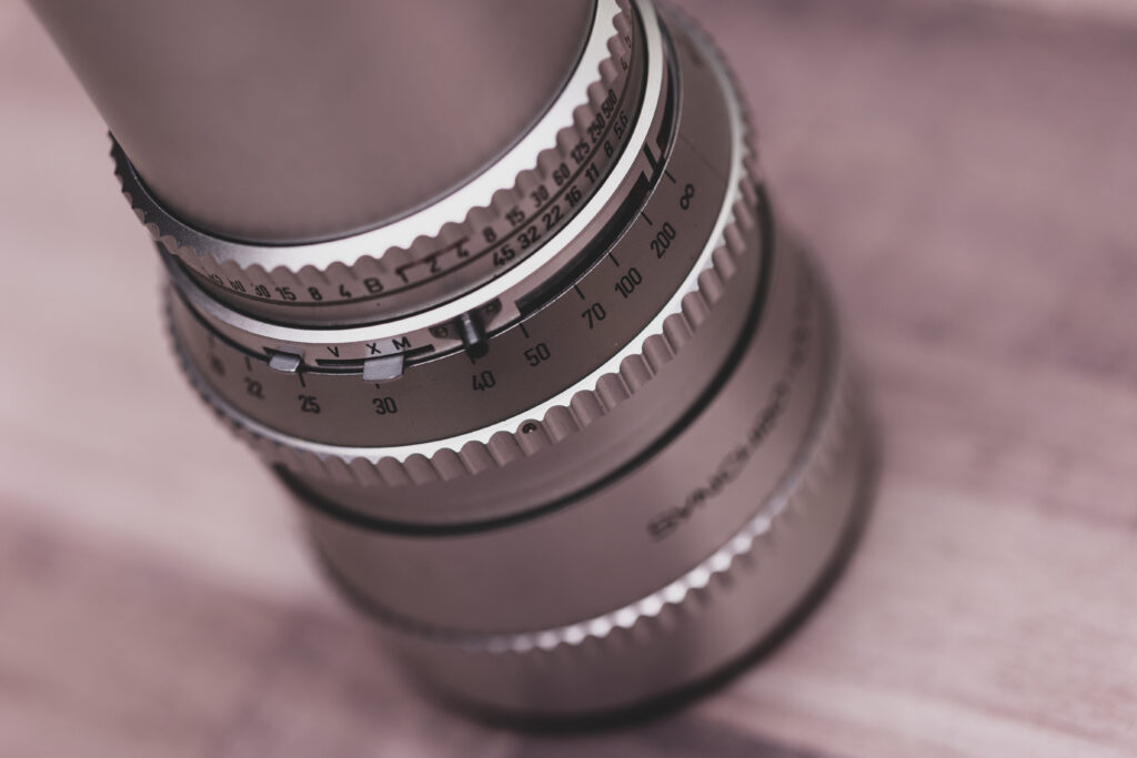 Intricate Metal Camera Lens Wallpaper: Close-Up Detail and Texture
