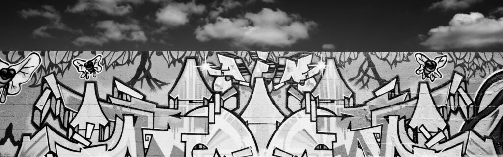 Intricate Monochrome Graffiti Art Wallpaper with Bold Patterns