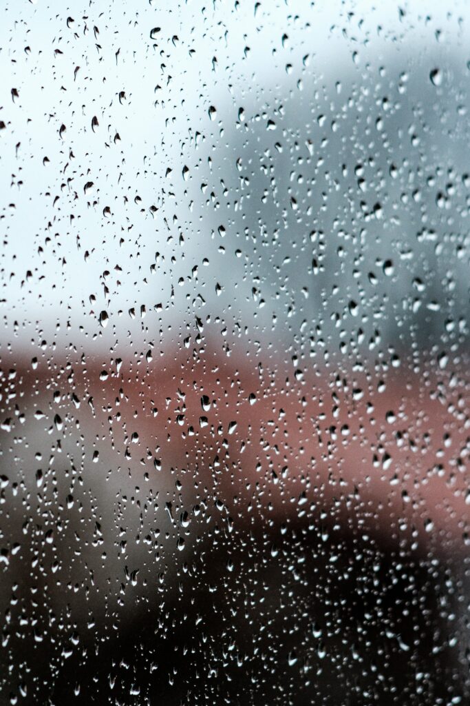 Intricate Water Droplets on Rainy Glass - Calming Wallpaper Background