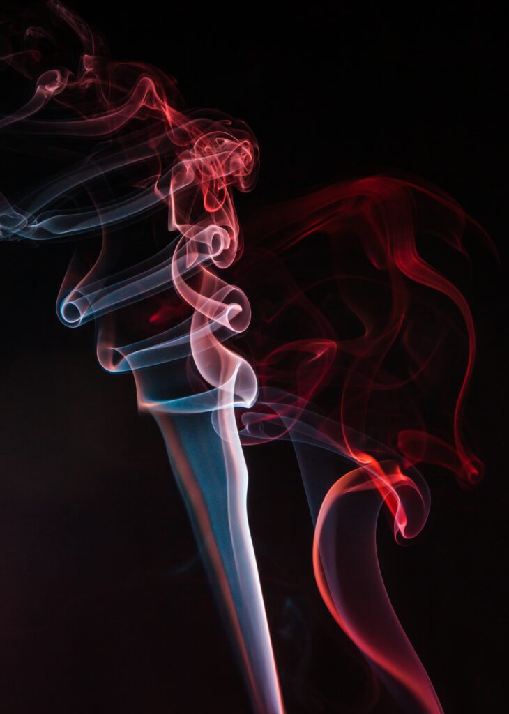 Vivid Red and White Smoke Swirls on Dark Background Wallpaper