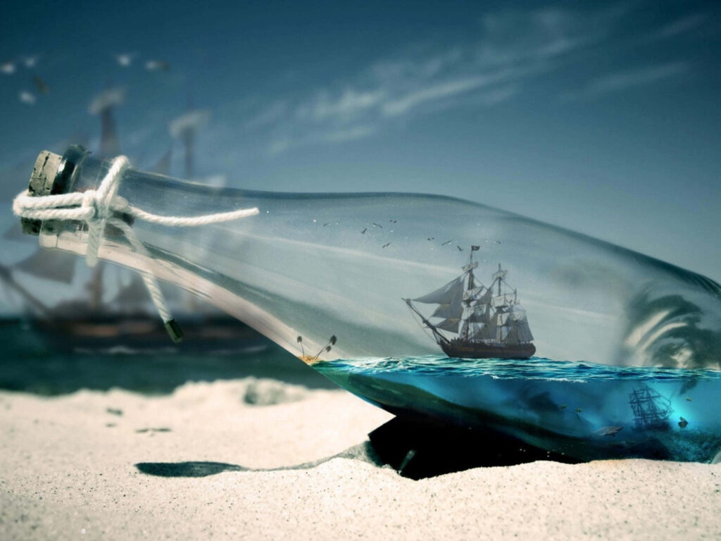 Miniature Ship in Glass Bottle on Sandy Beach - Whimsical Wallpaper