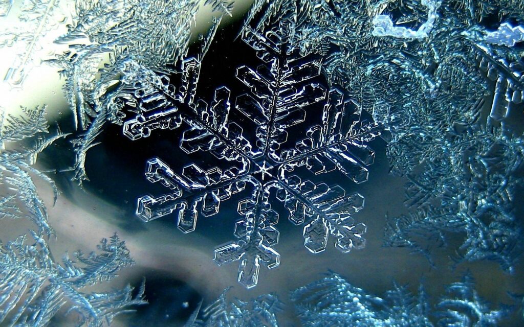 Detailed Macro Snowflake Wallpaper: Delicate Ice Crystal Background
