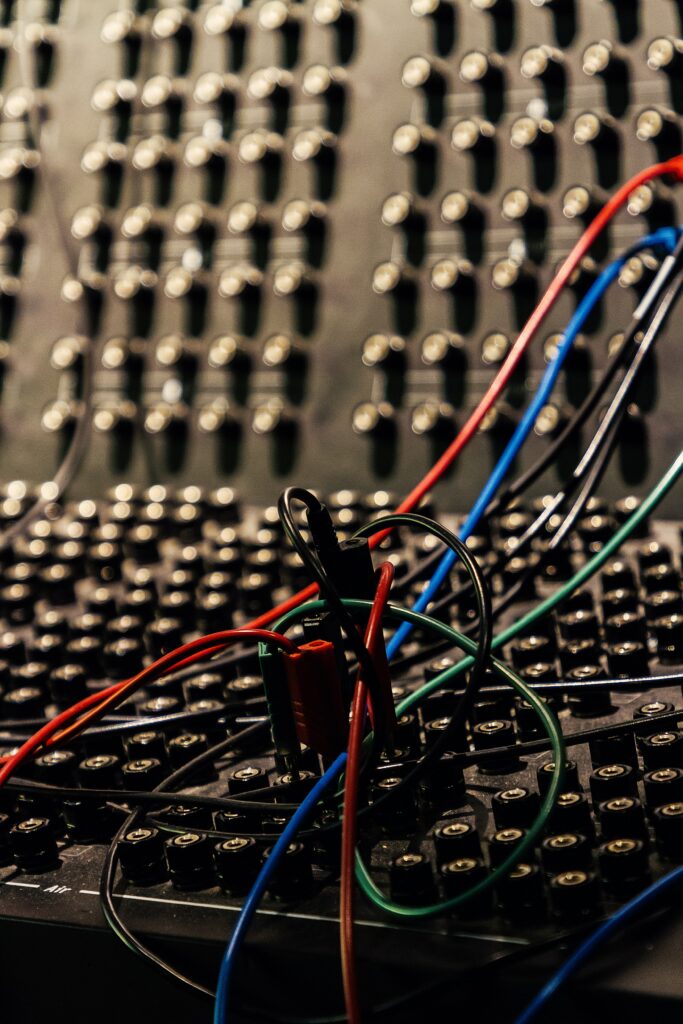Vibrant Sound Recording Setup: Close-Up of Audio Mixing Console Wires Wallpaper