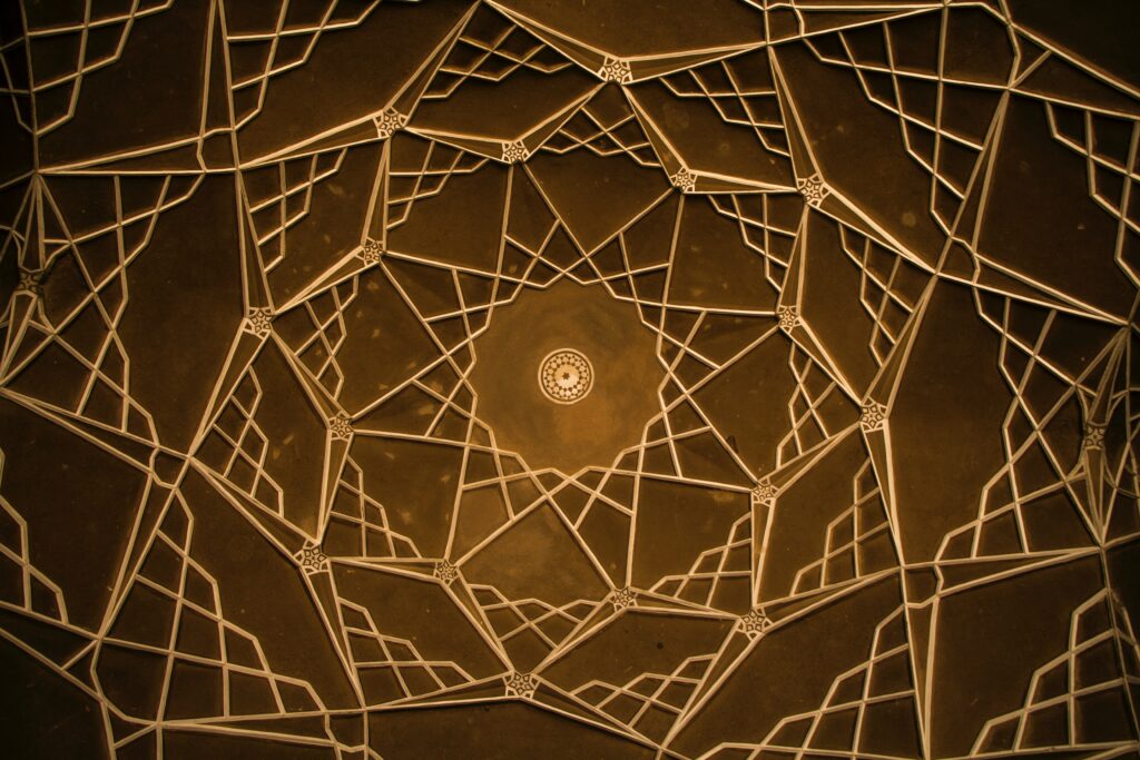 Intricate Brown Architectural Wallpaper: Hypnotic Geometric Design