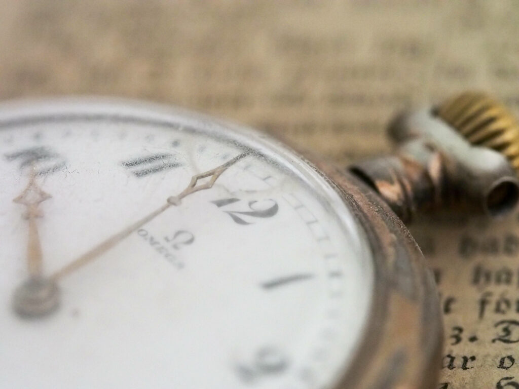 Vintage Omega Pocket Watch Close-Up: Timeless Elegance Wallpaper