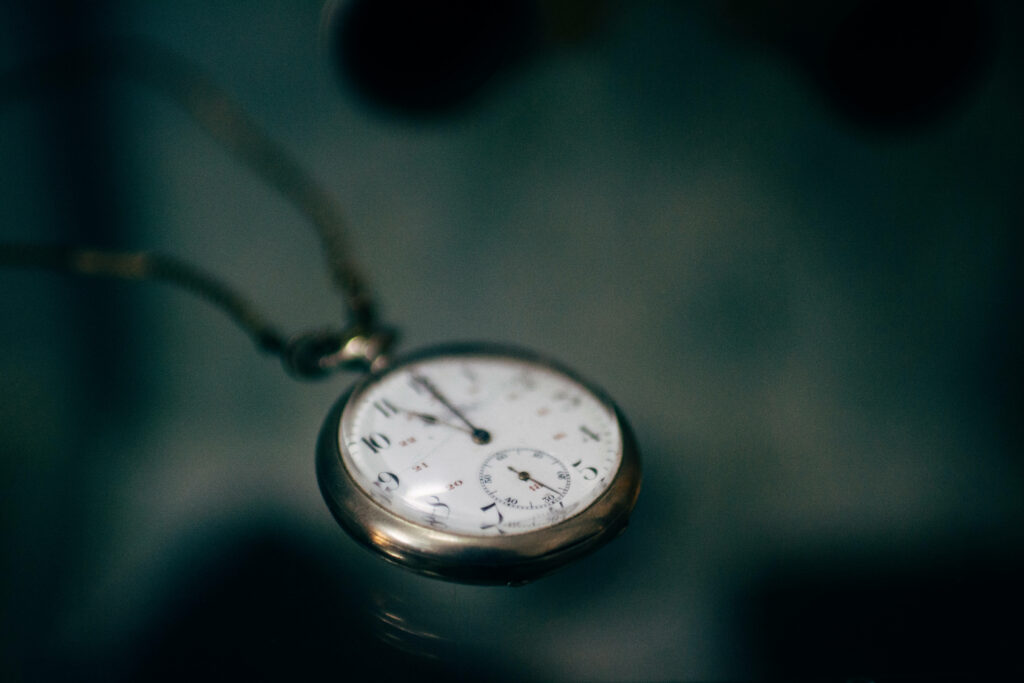 Vintage Pocket Watch Close-Up: Timeless Charm Wallpaper Background