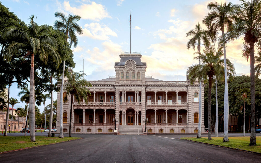 Iolani Palace Hawaii neoclassical architecture with palm trees lush greenery morning light wallpaper