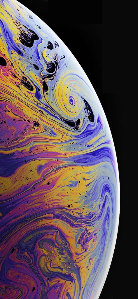 Macro abstract iPhone XS wallpaper with swirling iridescent yellow and purple liquid on black background