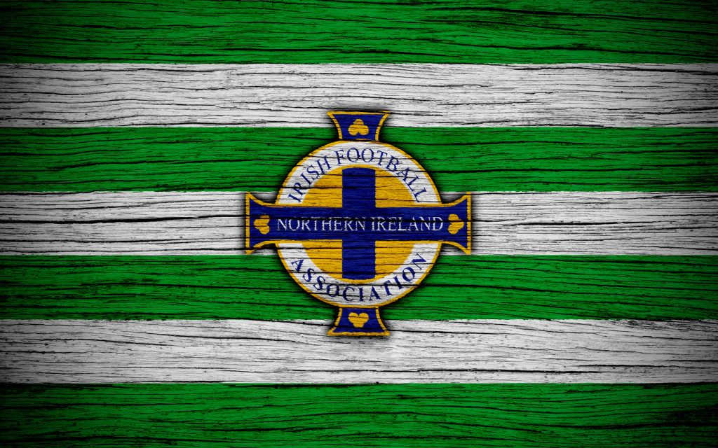 Irish Football Association emblem on rustic green white striped wood grain background wallpaper
