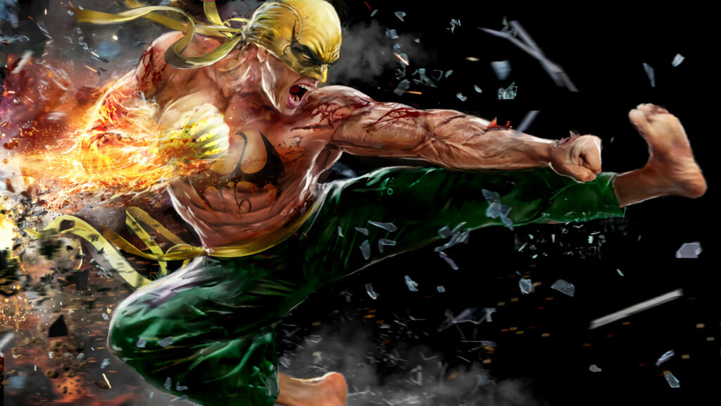 Epic Iron Fist Wallpaper: Fiery Action Pose Amidst Shattered Debris