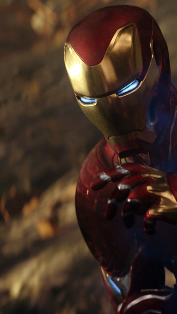 Iron Man in red and gold suit lit by cinematic light Avengers Infinity War phone wallpaper background