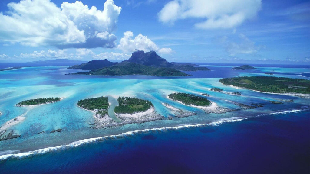 Paradise Found: Exploring the Multitude of Summer Islands with Mesmerizing Aerial View Wallpaper