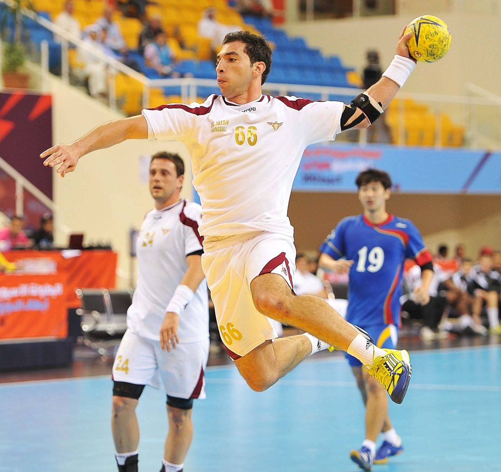 Issam Tej handball jump shot number 66 El Jaish dynamic indoor court wallpaper background