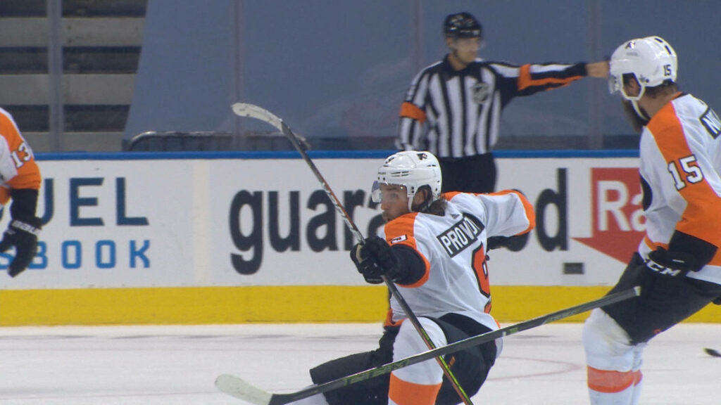 Ivan Provorov Ice Hockey Action Wallpaper: Dynamic Game Moment