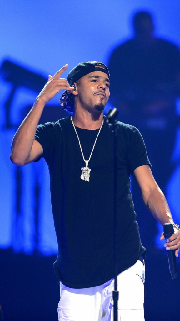Dynamic Showcase: J Cole Enthralling the Stage with Hip Hop Beats Wallpaper