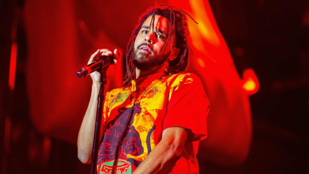J Cole's Bold Style in Vibrant Red Yellow T-Shirt: Captivating HD Wallpaper Snapshot