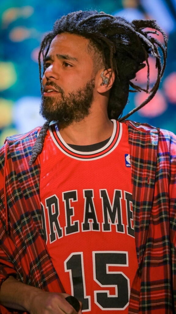 J Cole: The Hip Hop Maestro in Action Wallpaper