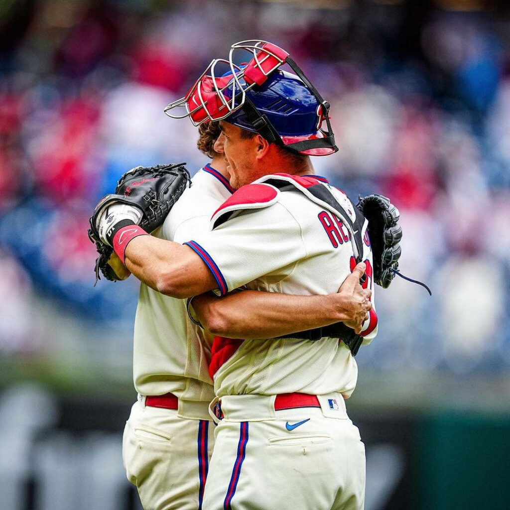 JT Realmuto Celebrates with Teammate: Baseball Field Wallpaper