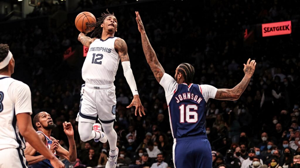 Ja Morant airborne dunk over Johnson Brooklyn Nets dynamic basketball action HD wallpaper